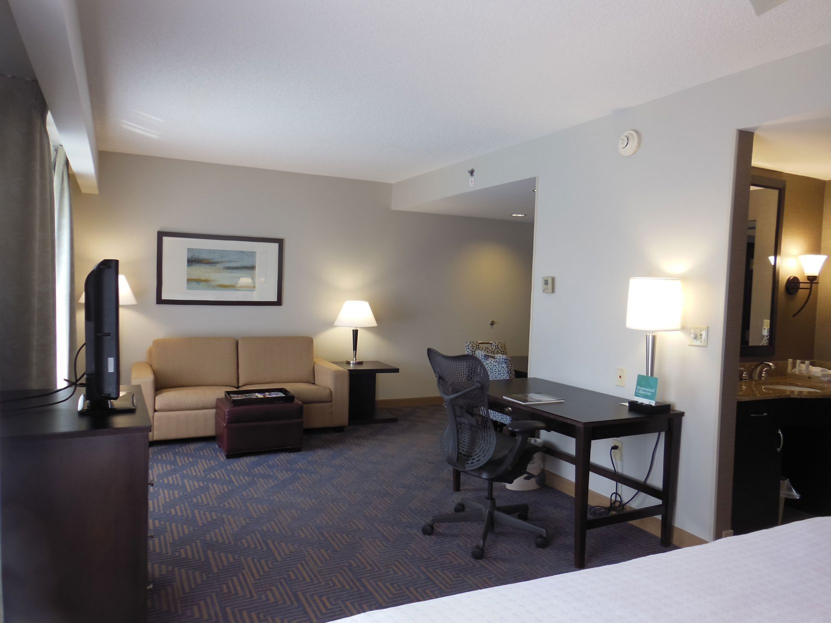 Premium bedding, pillow-top beds, desk, laptop workspace