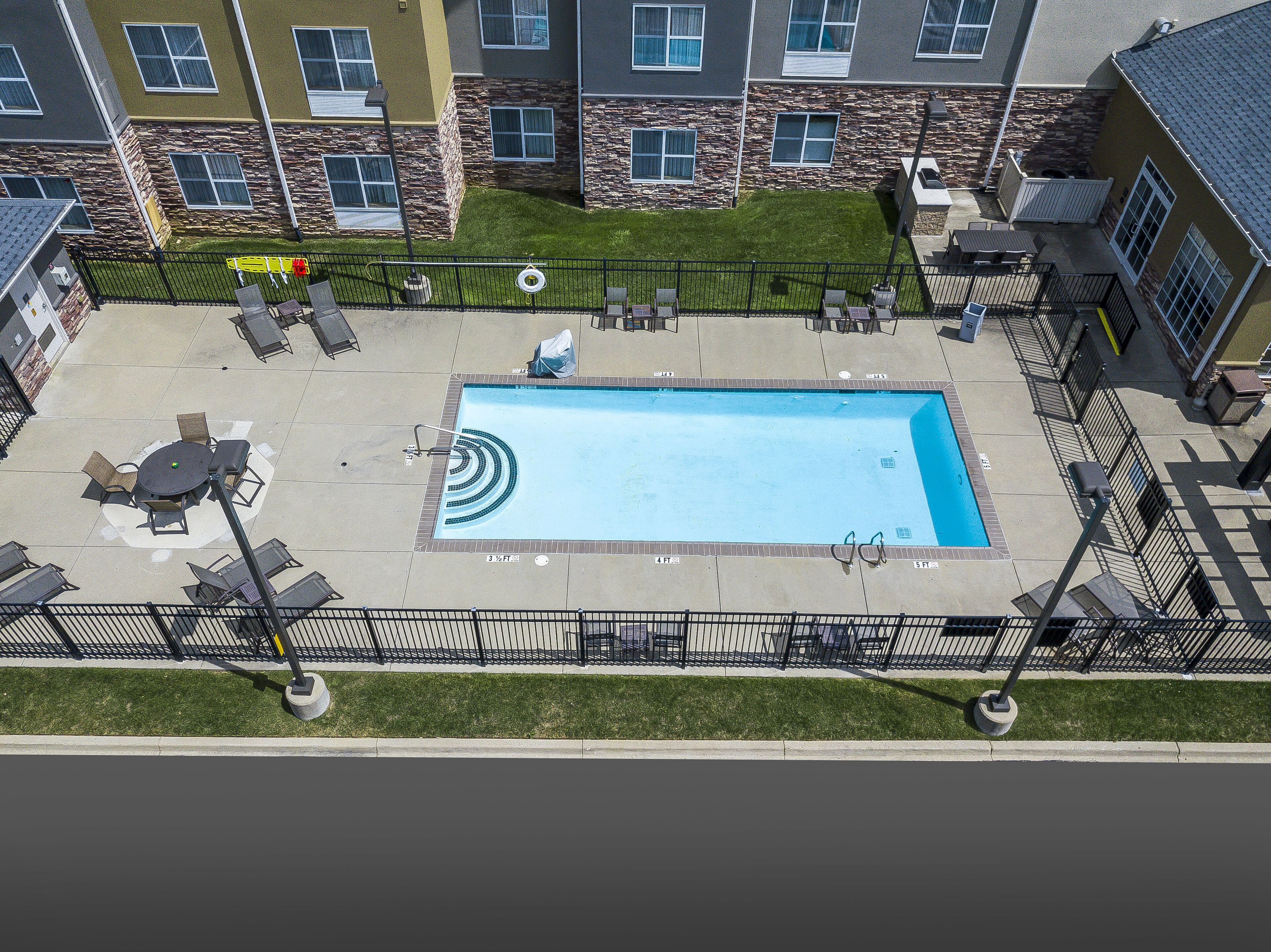 seasonal outdoor pool, open 10 am to 10 pm, pool loungers