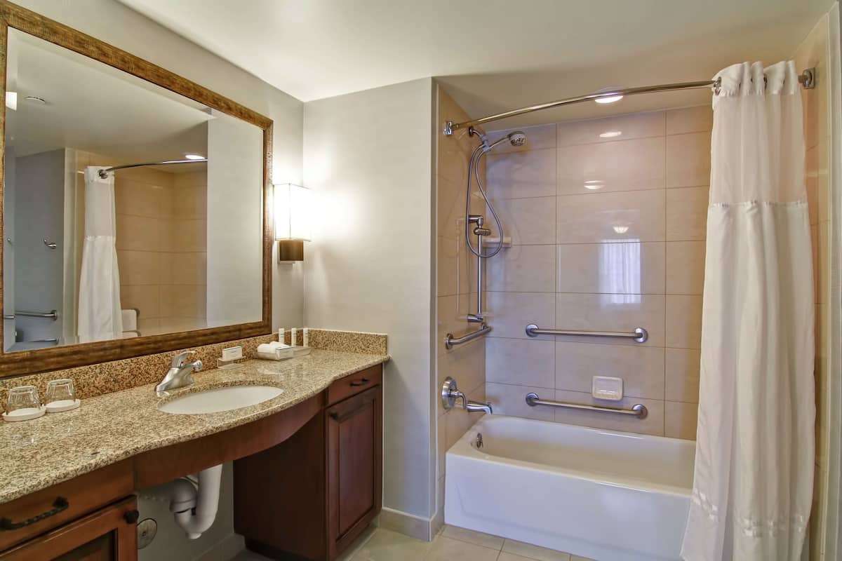 studio, 1 king bed, accessible, bathtub | bathroom | combined shower/bathtub, free toiletries, hair dryer, towels
