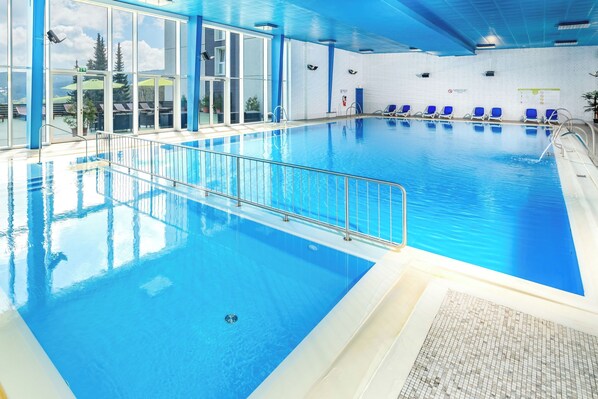 Indoor pool, open 7:00 AM to 10:00 PM, pool loungers
