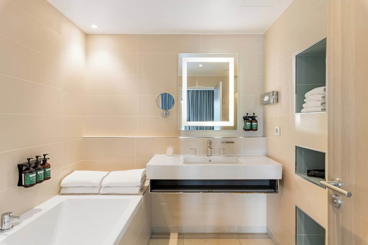 Suite, 1 Queen Bed, Balcony | In-room safe, desk, blackout drapes, soundproofing