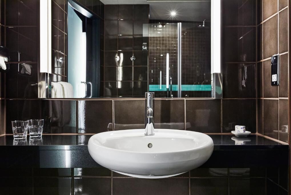 shower, designer toiletries, hair dryer, towels