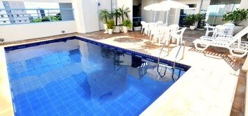 Outdoor pool, pool umbrellas, sun loungers