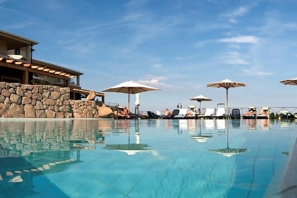 Seasonal outdoor pool, pool umbrellas, pool loungers