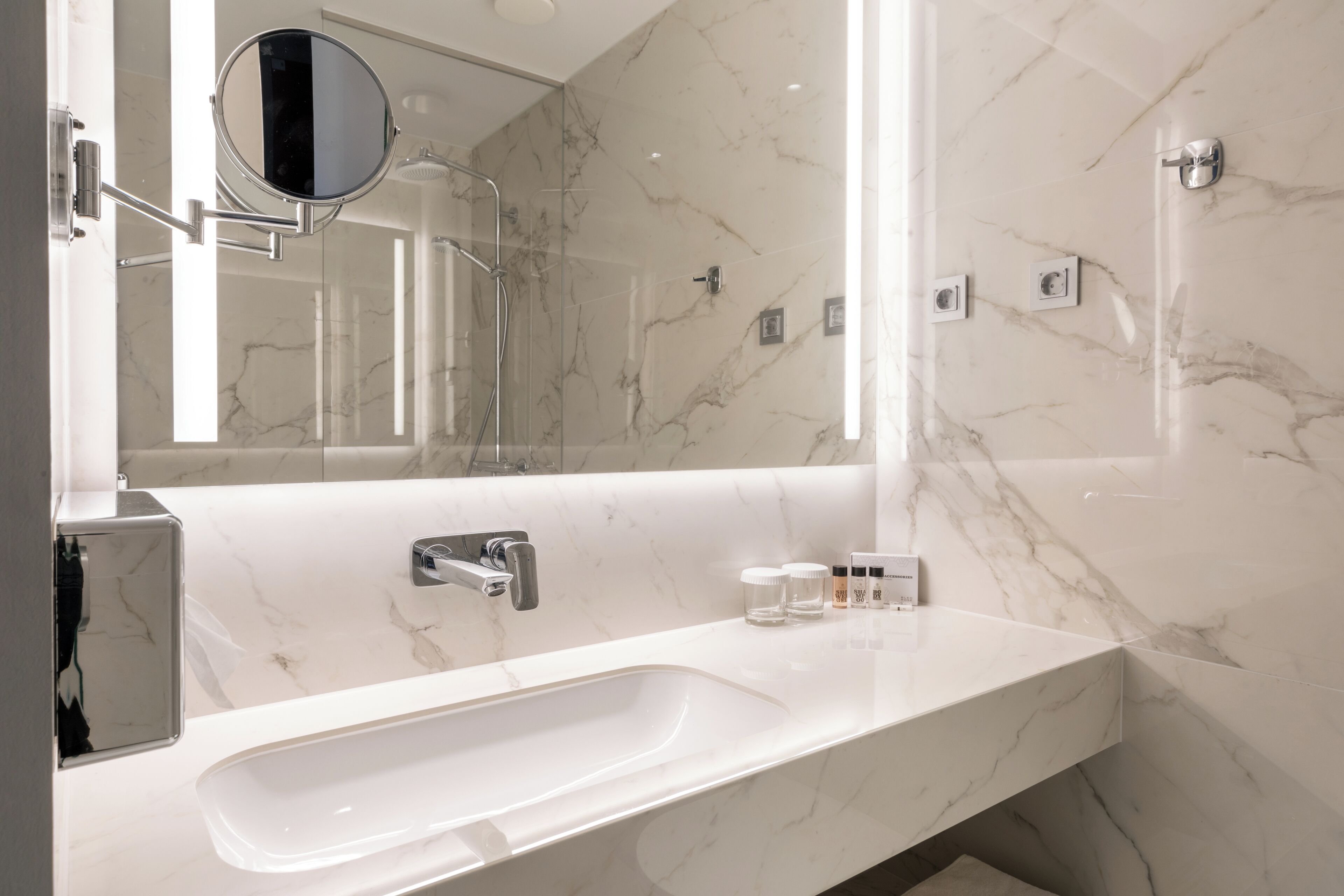 shower, hair dryer, slippers, towels