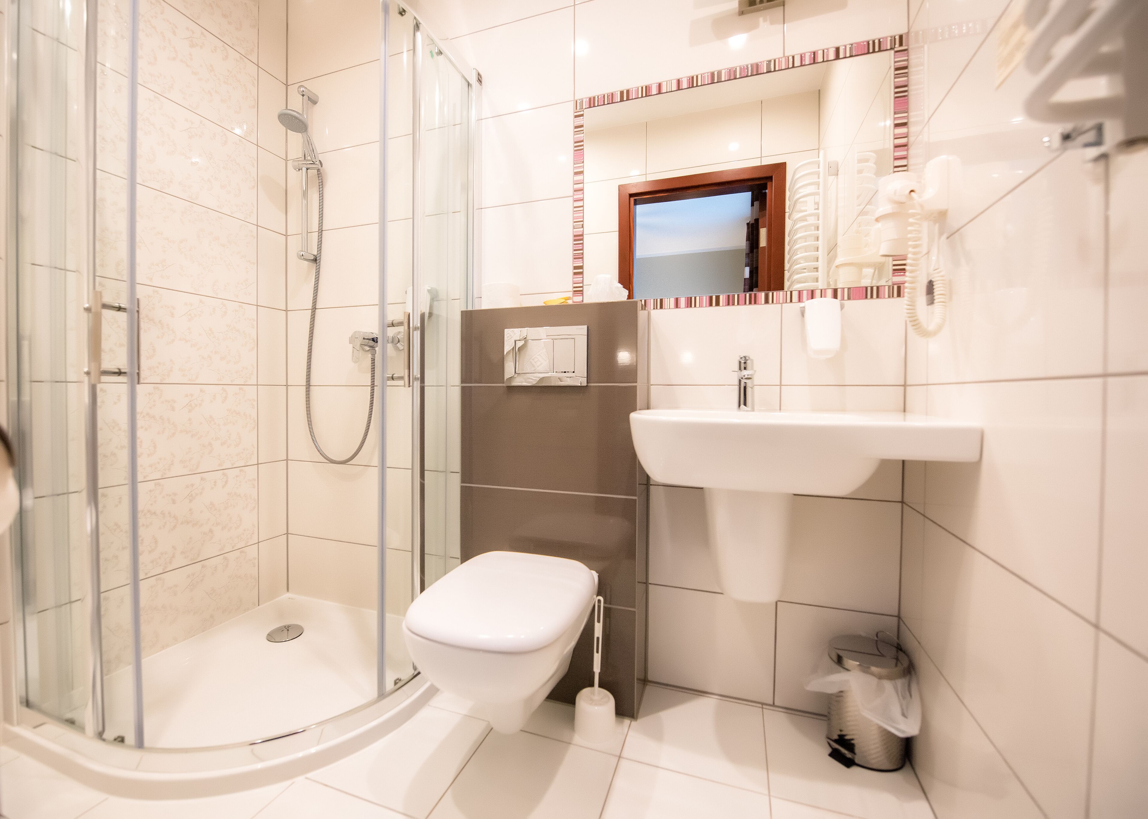 standard twin room | bathroom | shower, hair dryer, towels, soap