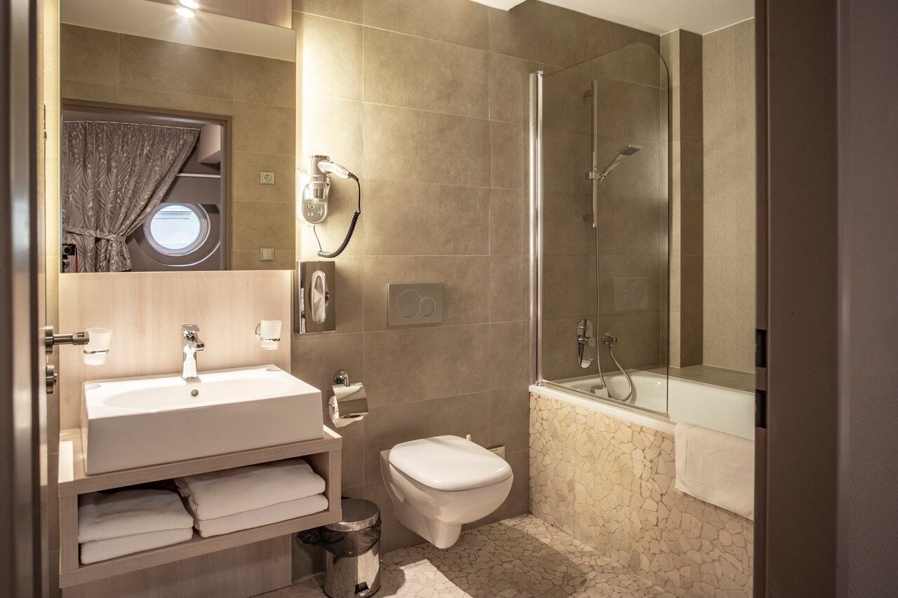 premium double room (ships cain) | bathroom | free toiletries, hair dryer, slippers, towels