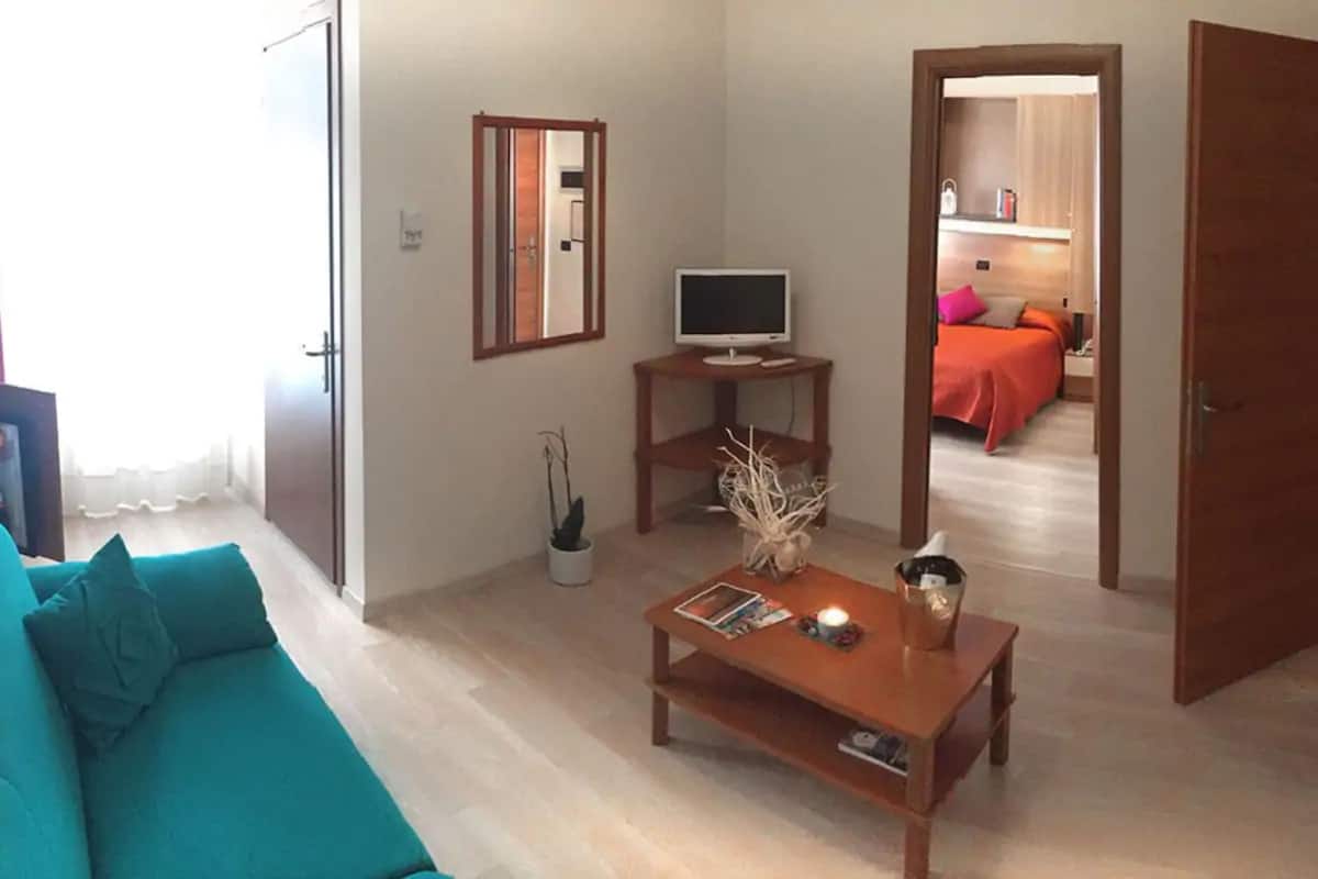 junior suite | living area | flat-screen tv