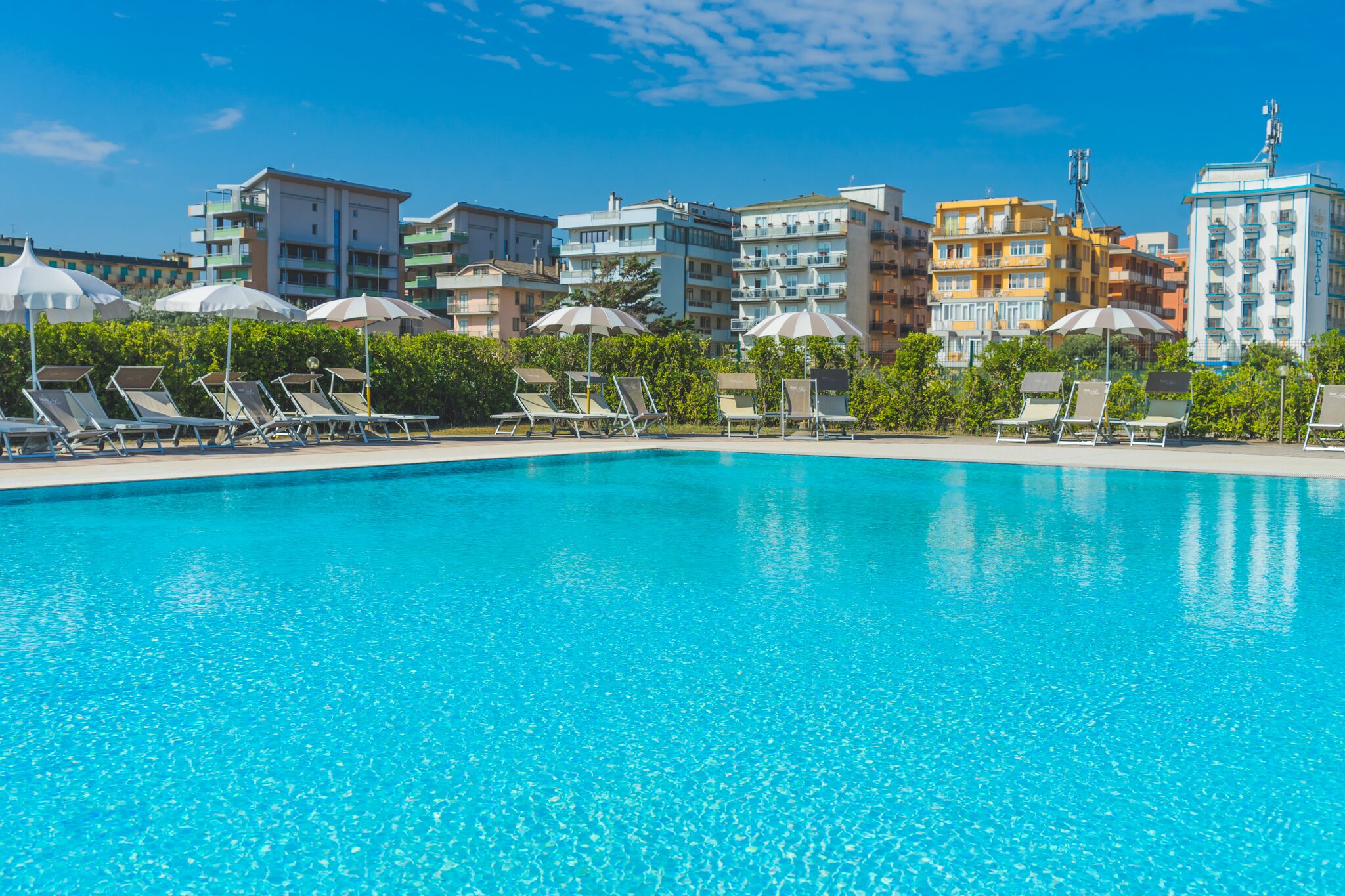 Seasonal outdoor pool, pool umbrellas, pool loungers