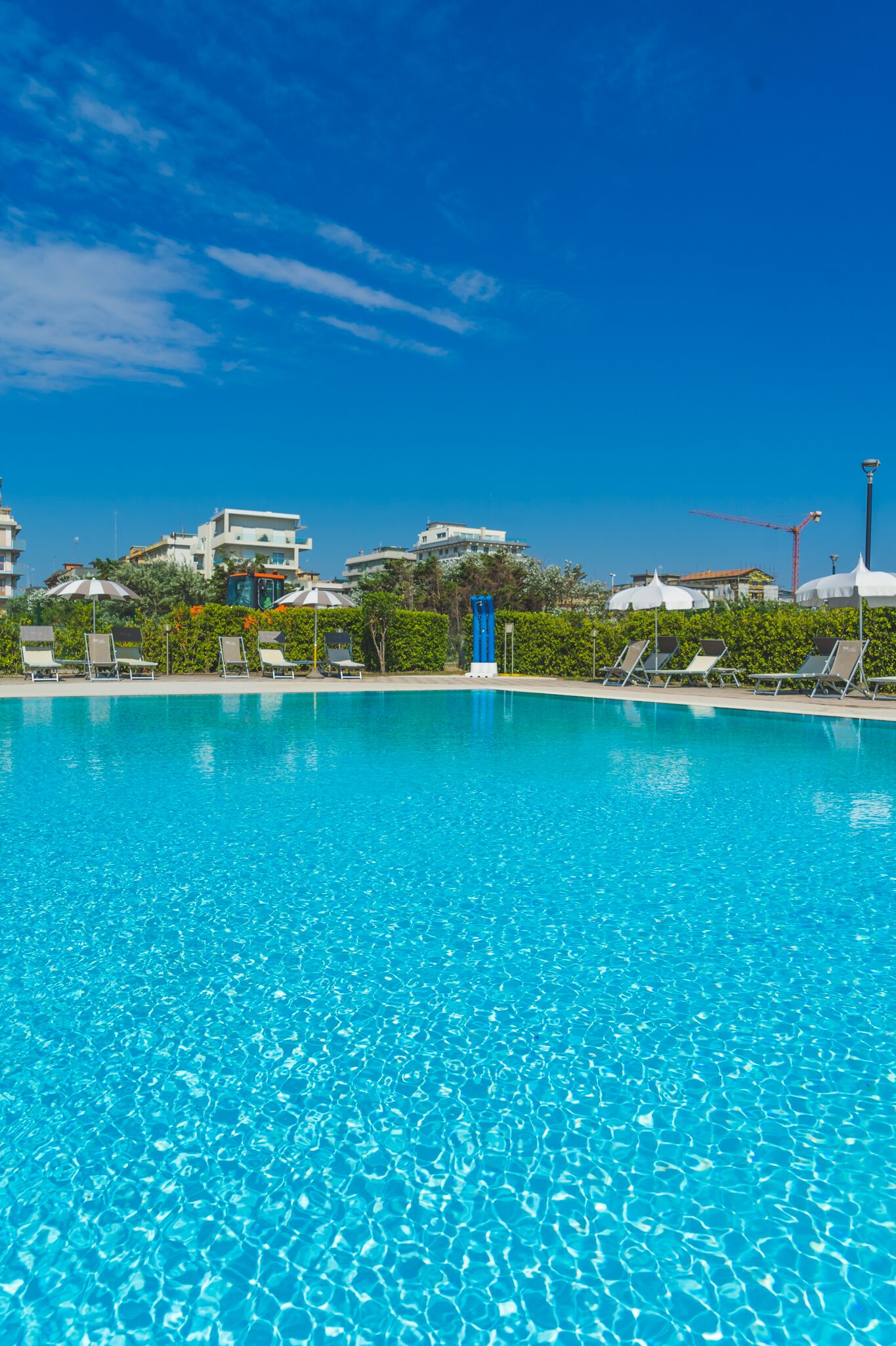 seasonal outdoor pool, pool umbrellas, pool loungers