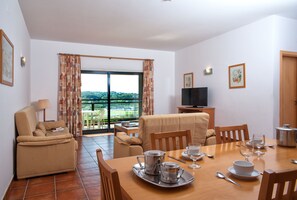 Apartment, 4 Bedrooms | Living room | TV