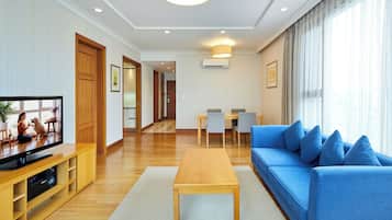 Executive Room, 2 Bedrooms | Living area | TV, heated floors