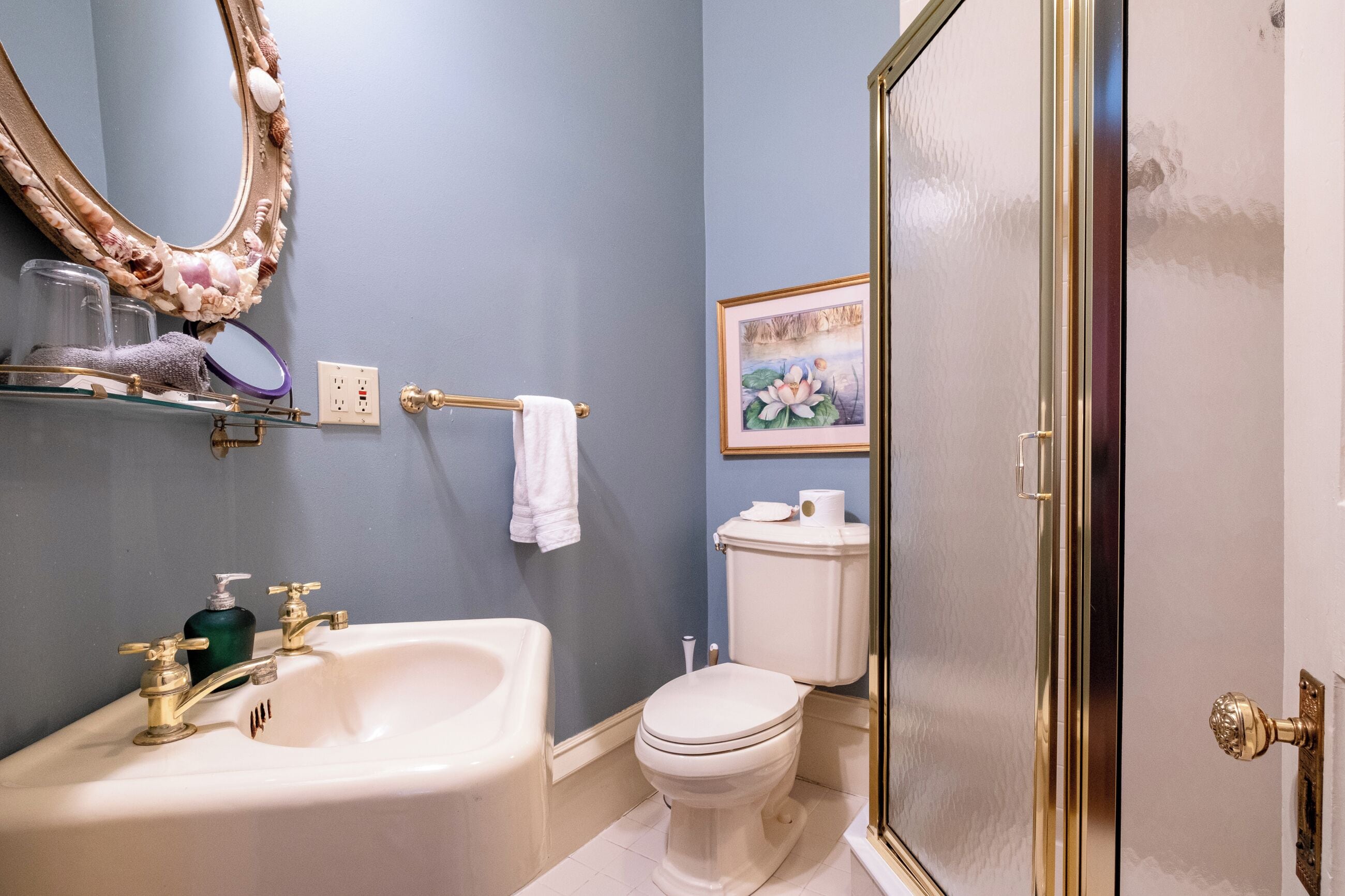 A bathroom with a bathtub, sink, toilet, and a shower.