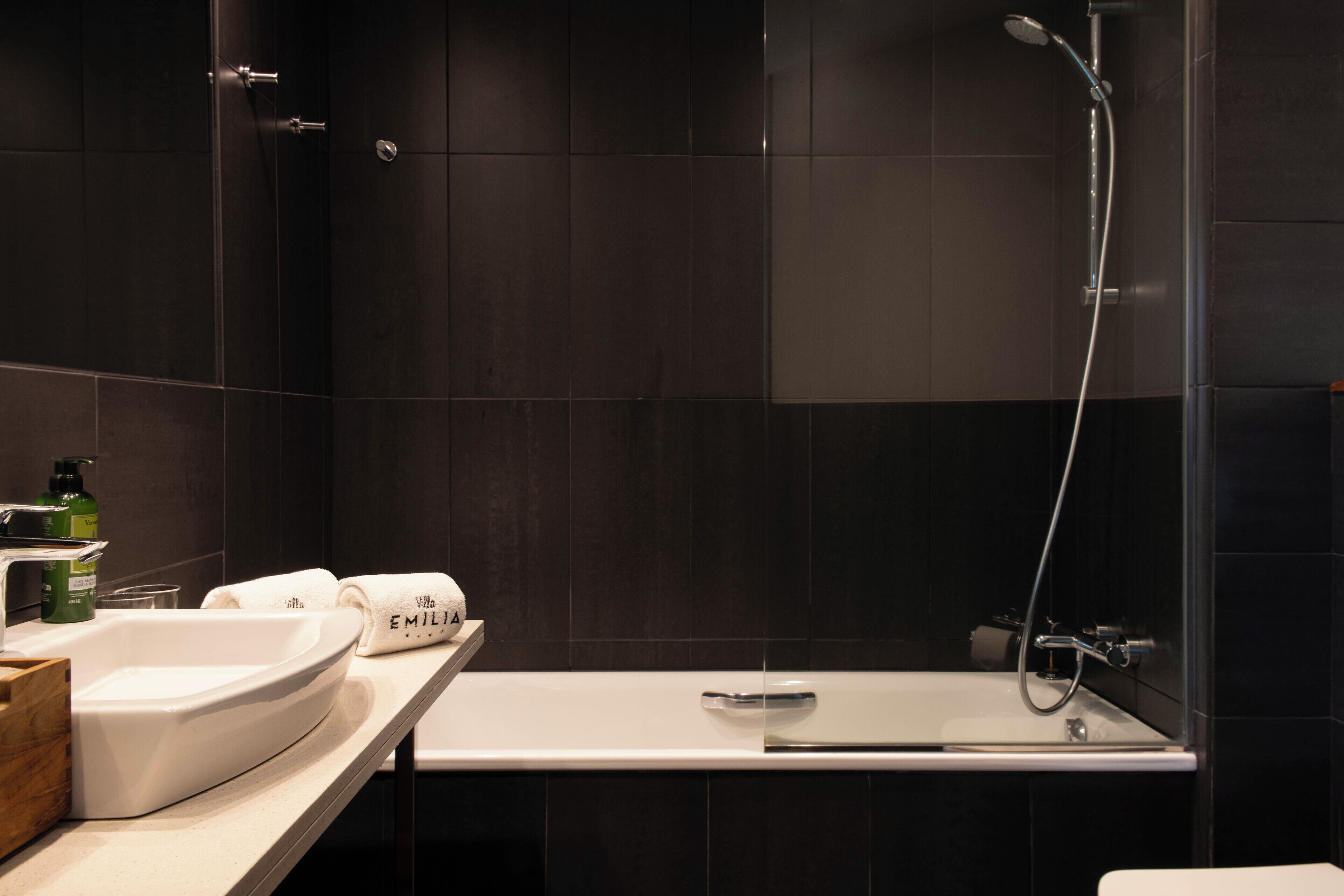 designer toiletries, hair dryer, towels, soap