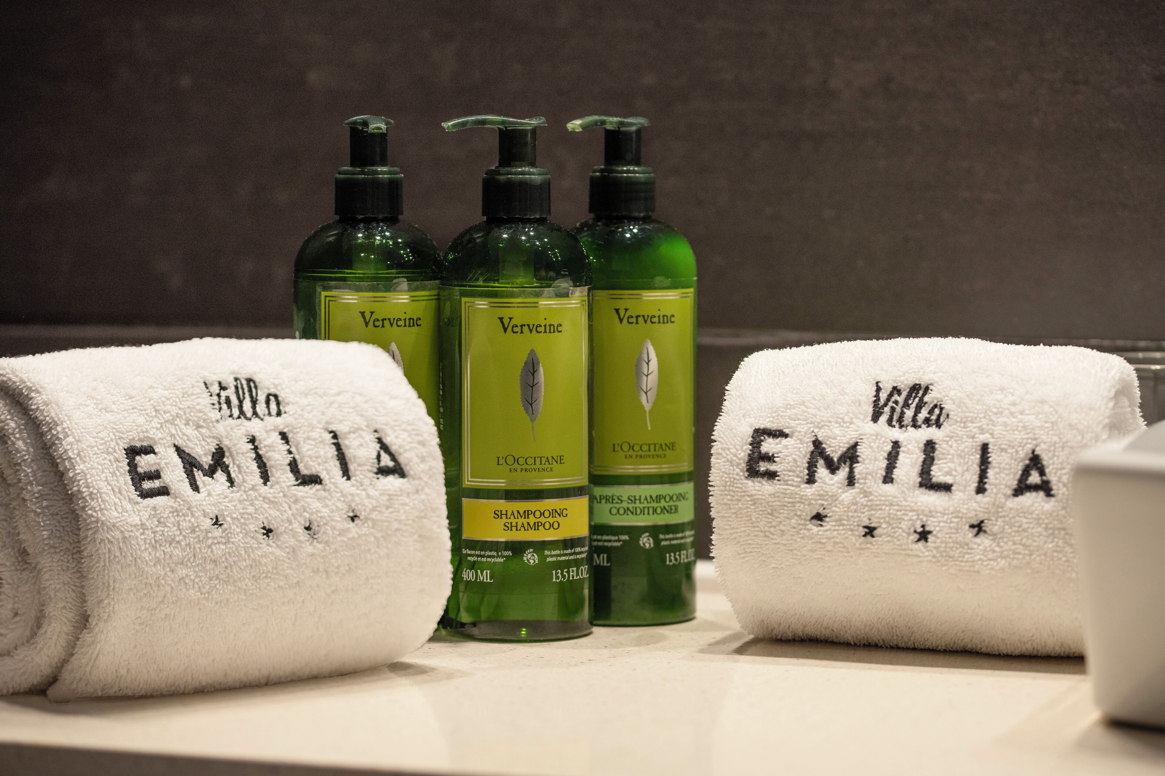 designer toiletries, hair dryer, towels, soap