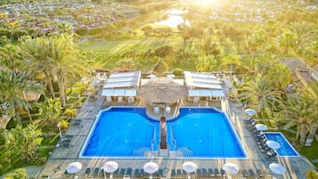 Indoor pool, 2 outdoor pools, open 10:00 AM to 6:00 PM, pool umbrellas