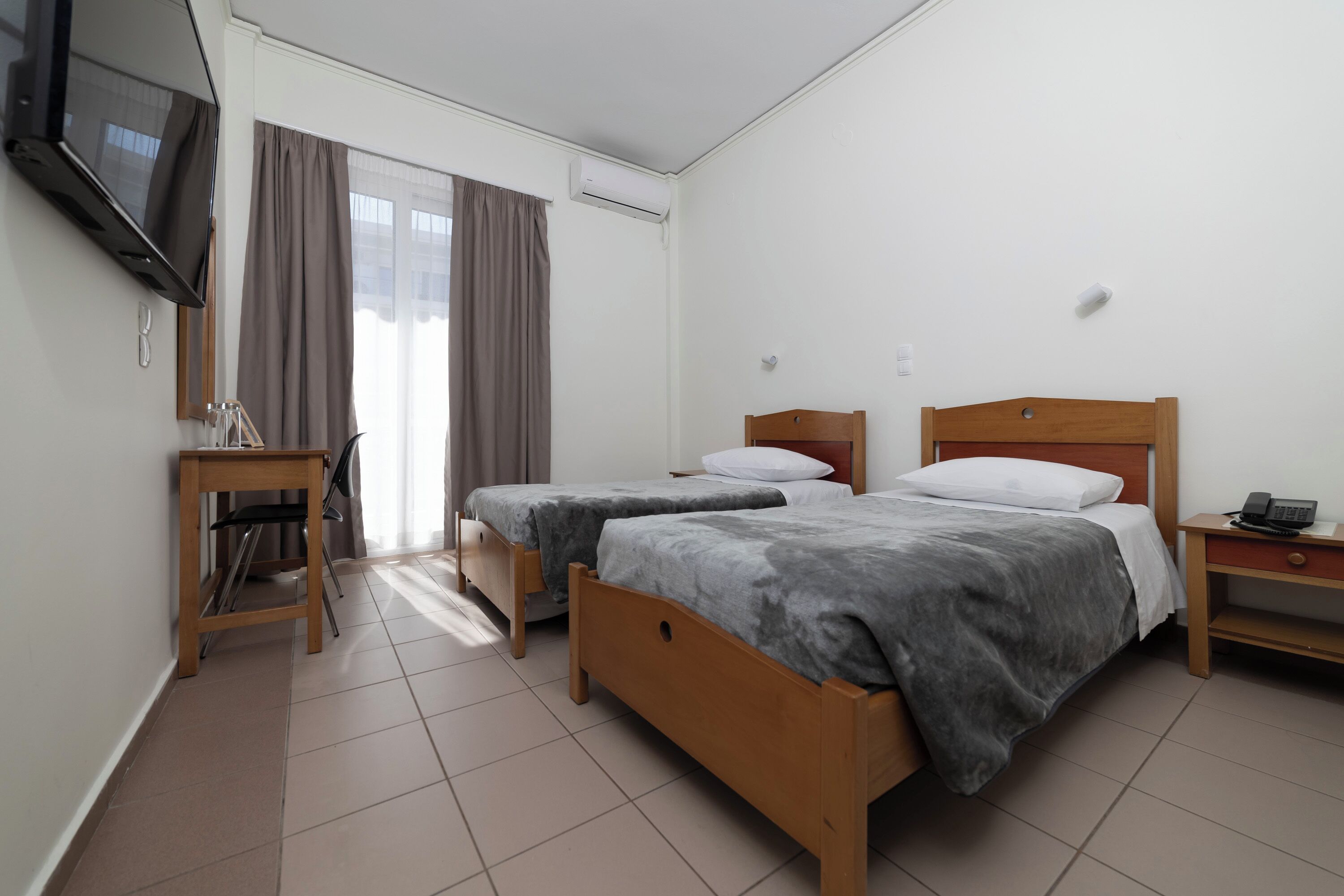 Hypo-allergenic bedding, desk, blackout drapes, iron/ironing board