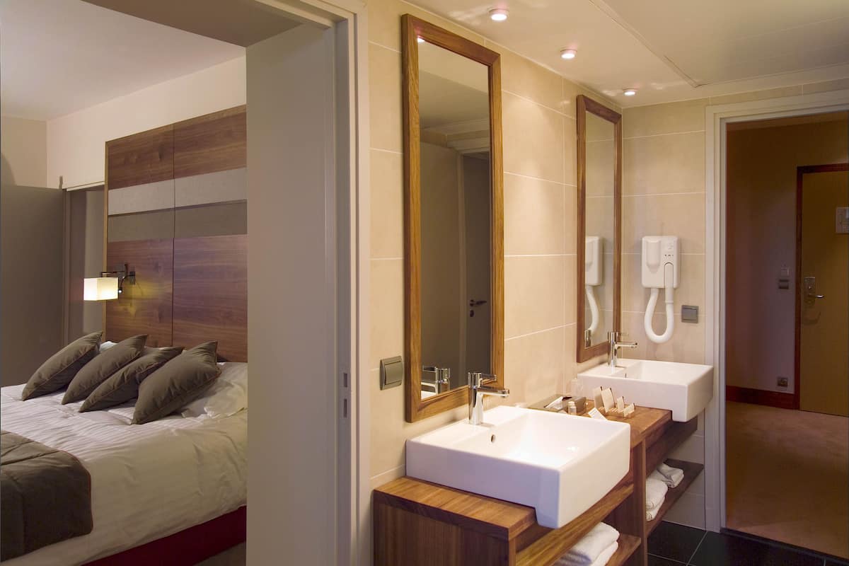 prestige suite | bathroom | rainfall showerhead, free toiletries, hair dryer, bathrobes