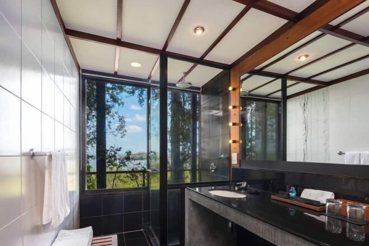 Bathroom | Rainfall showerhead, free toiletries, hair dryer, bathrobes