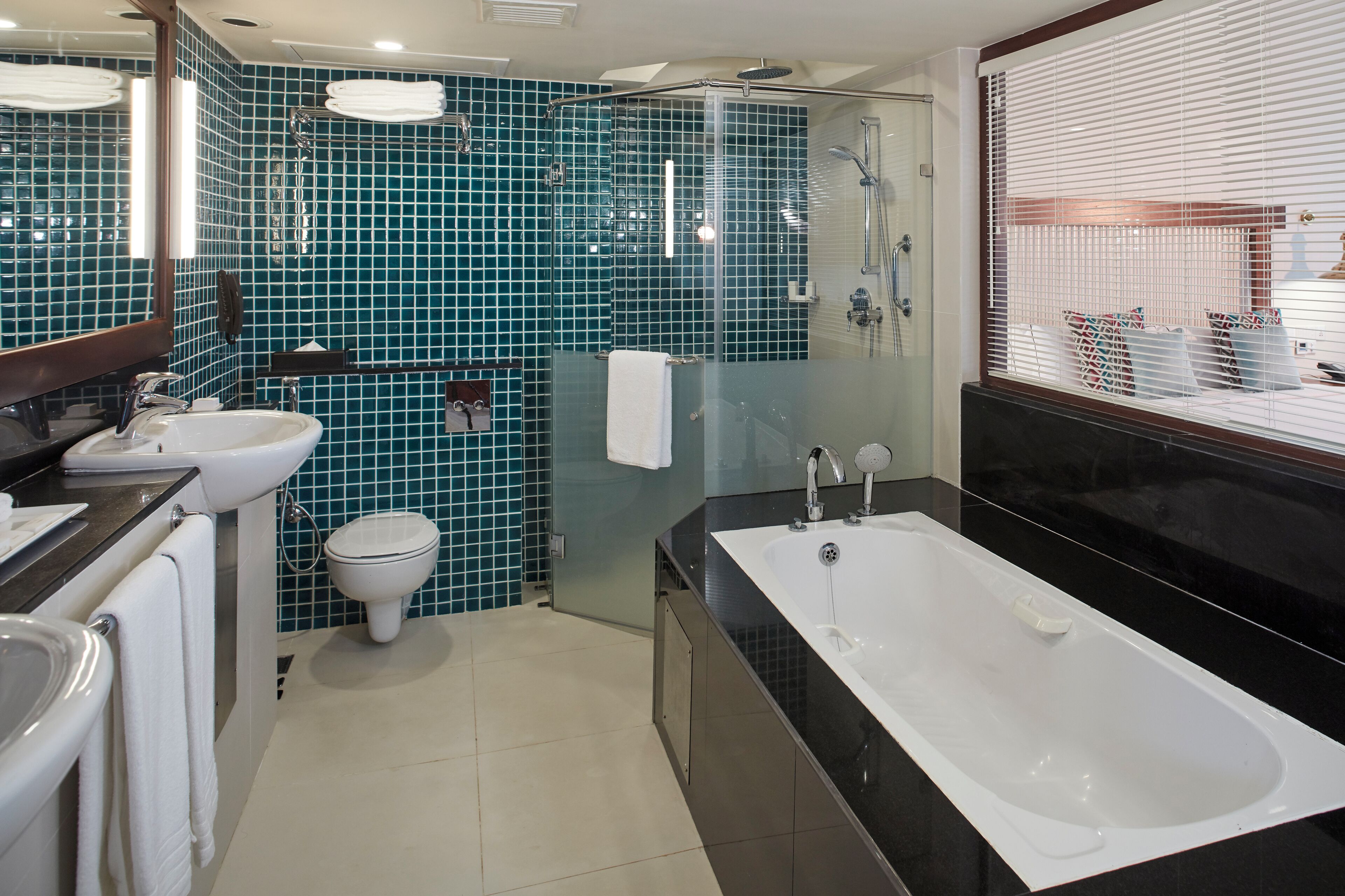 designer toiletries, hair dryer, bathrobes, slippers