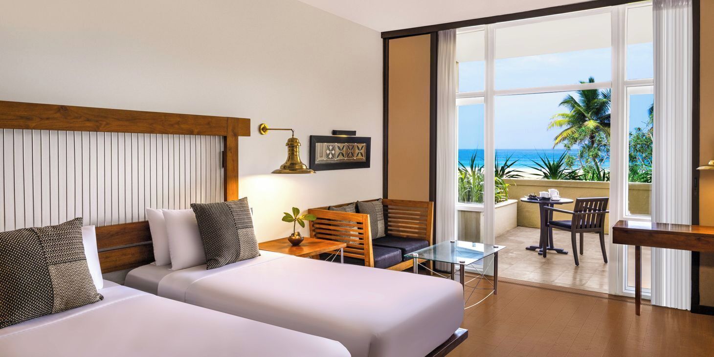 Deluxe Twin Room | Minibar, in-room safe, desk, laptop workspace