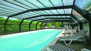 Indoor pool, seasonal outdoor pool, open 9 AM to 7 PM, pool umbrellas