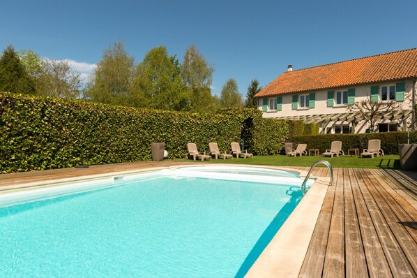 Indoor pool, seasonal outdoor pool, open 9 AM to 7 PM, pool umbrellas