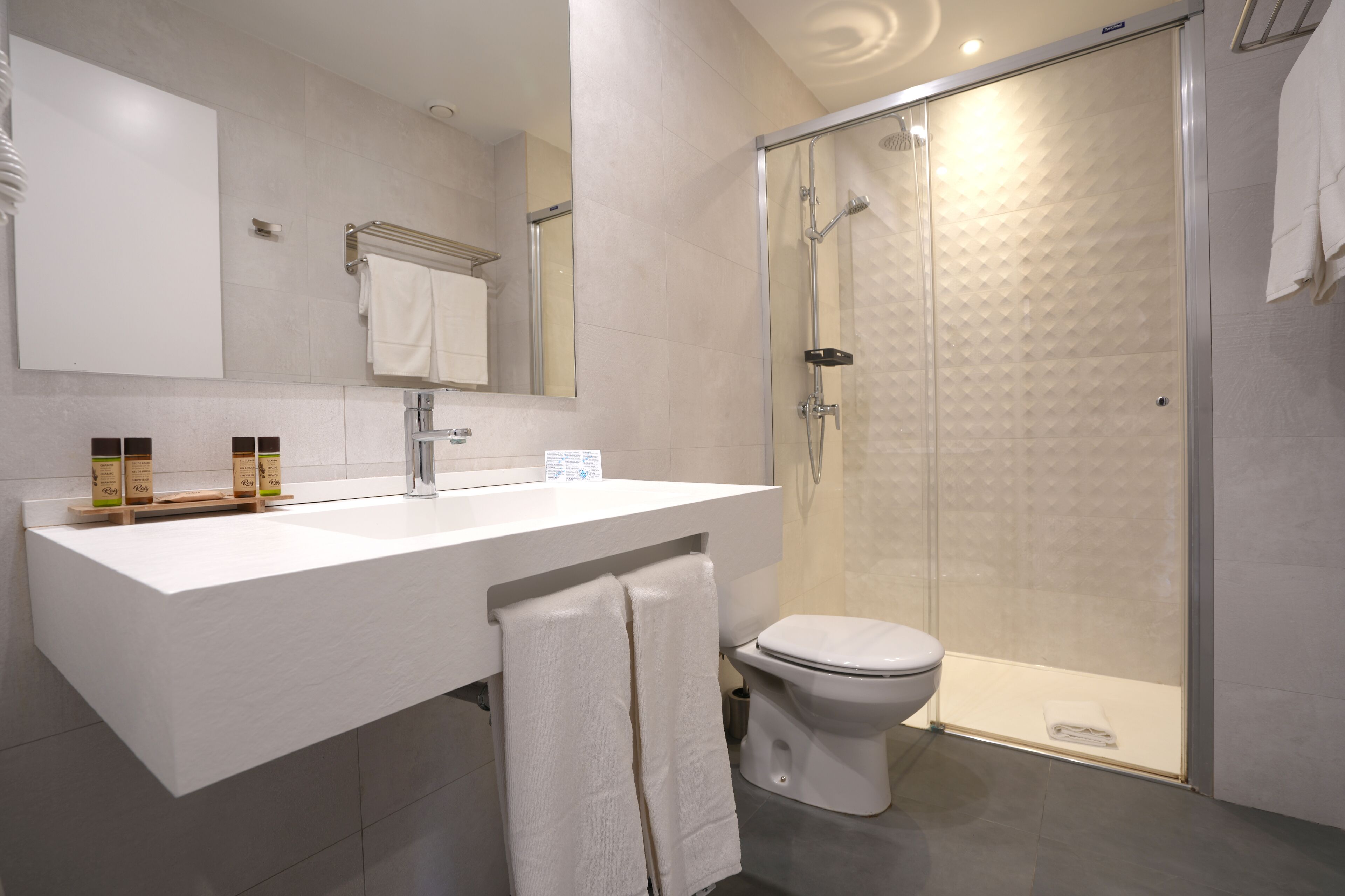 shower, free toiletries, hair dryer, towels