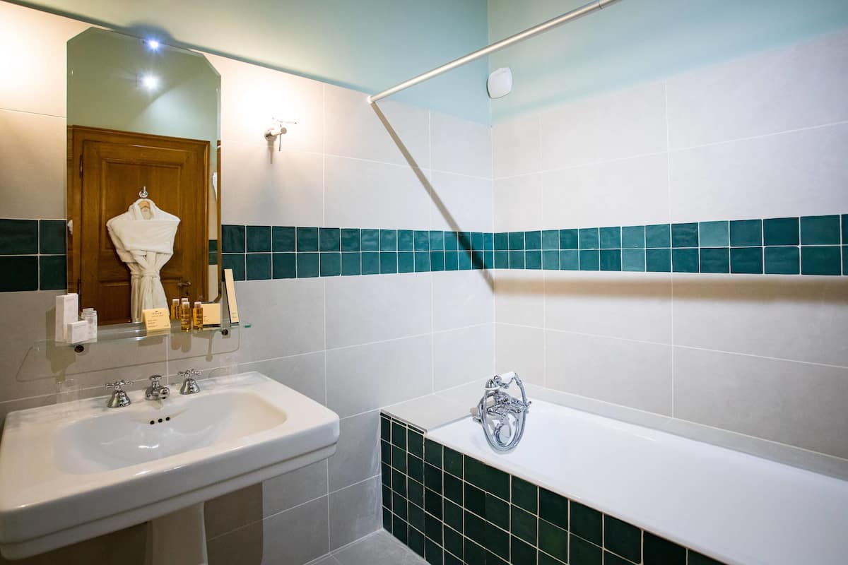 suite | bathroom | hair dryer, bathrobes, slippers, towels