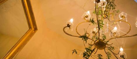 A chandelier with multiple light bulbs and decorative elements.