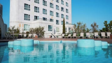 Indoor pool, outdoor pool, pool umbrellas, pool loungers