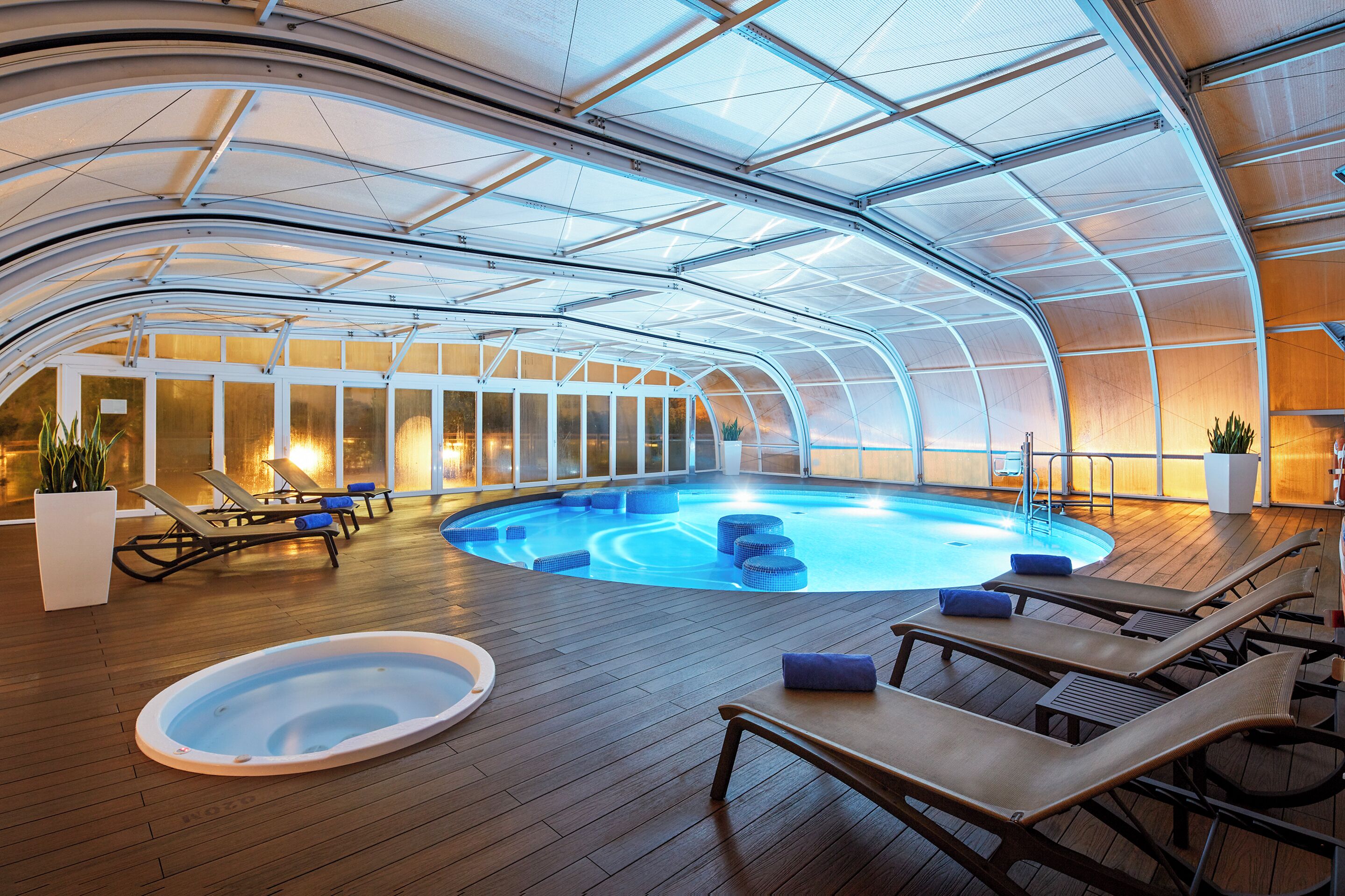 indoor pool, outdoor pool, pool umbrellas, pool loungers