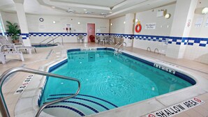 An indoor swimming pool with a shallow area, a lifeguard chair, and a no diving sign. - Fairfield Inn & Suites by Marriott Sudbury (Sudbury)