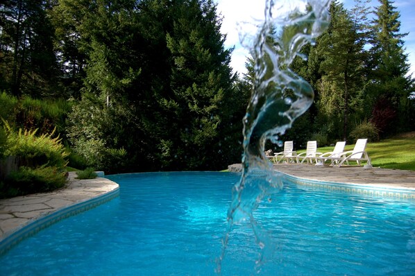 Seasonal outdoor pool, open 11:00 AM to 9:00 PM, pool umbrellas