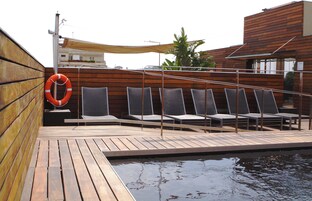 Seasonal outdoor pool, open 9:00 AM to 7:00 PM, sun loungers