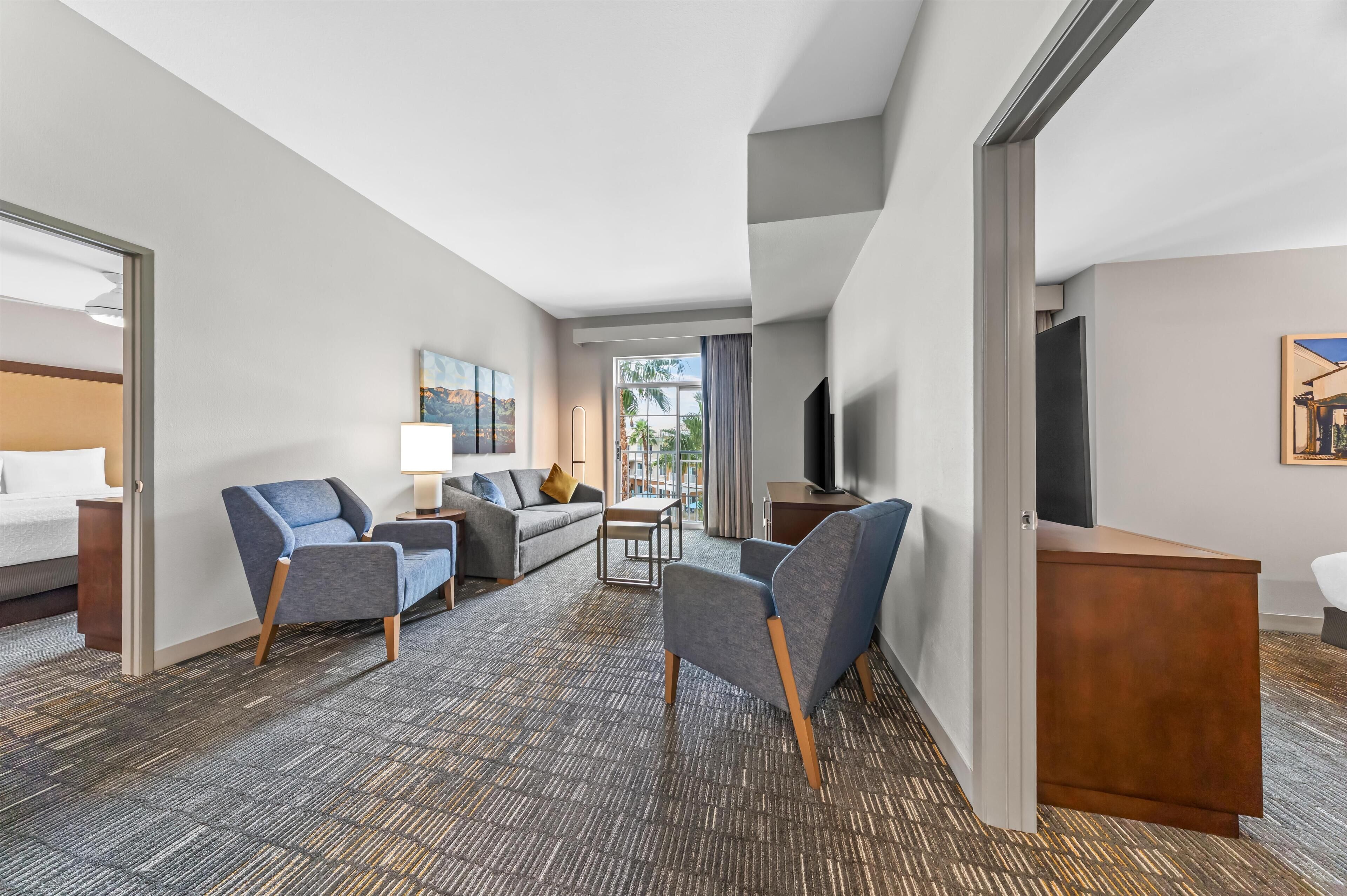 Suite, 2 Bedrooms, Non Smoking | Living area | 42-inch flat-screen TV with cable channels, TV, video-game console