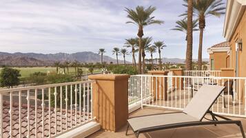 Enjoy breathtaking views of the surrounding mountains from this balcony.