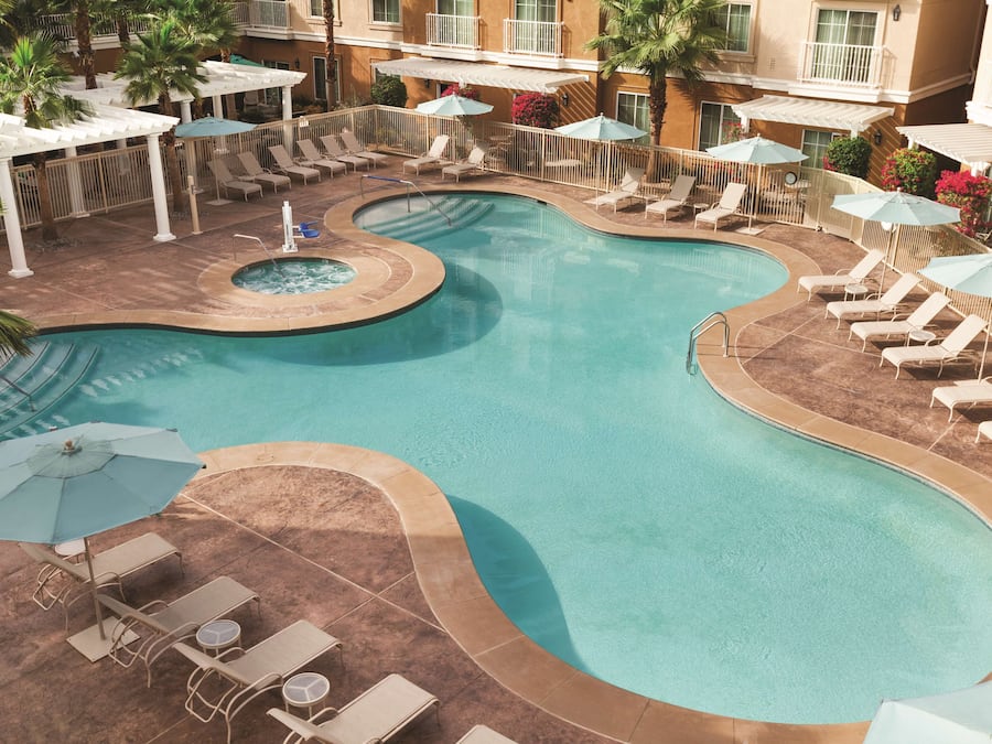 Outdoor pool, open 9:00 AM to 9:00 PM, pool loungers