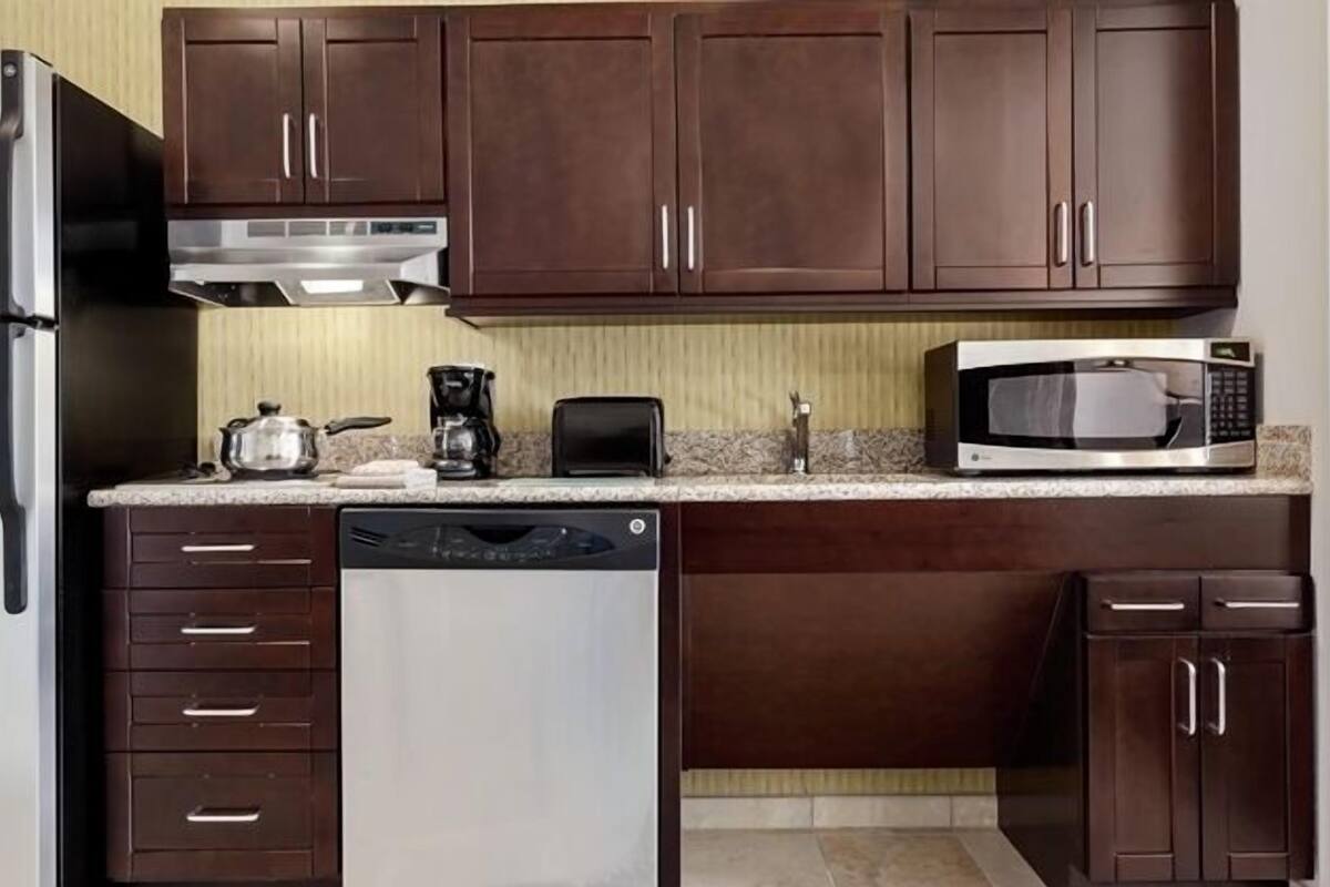 full-sized fridge, microwave, stovetop, dishwasher