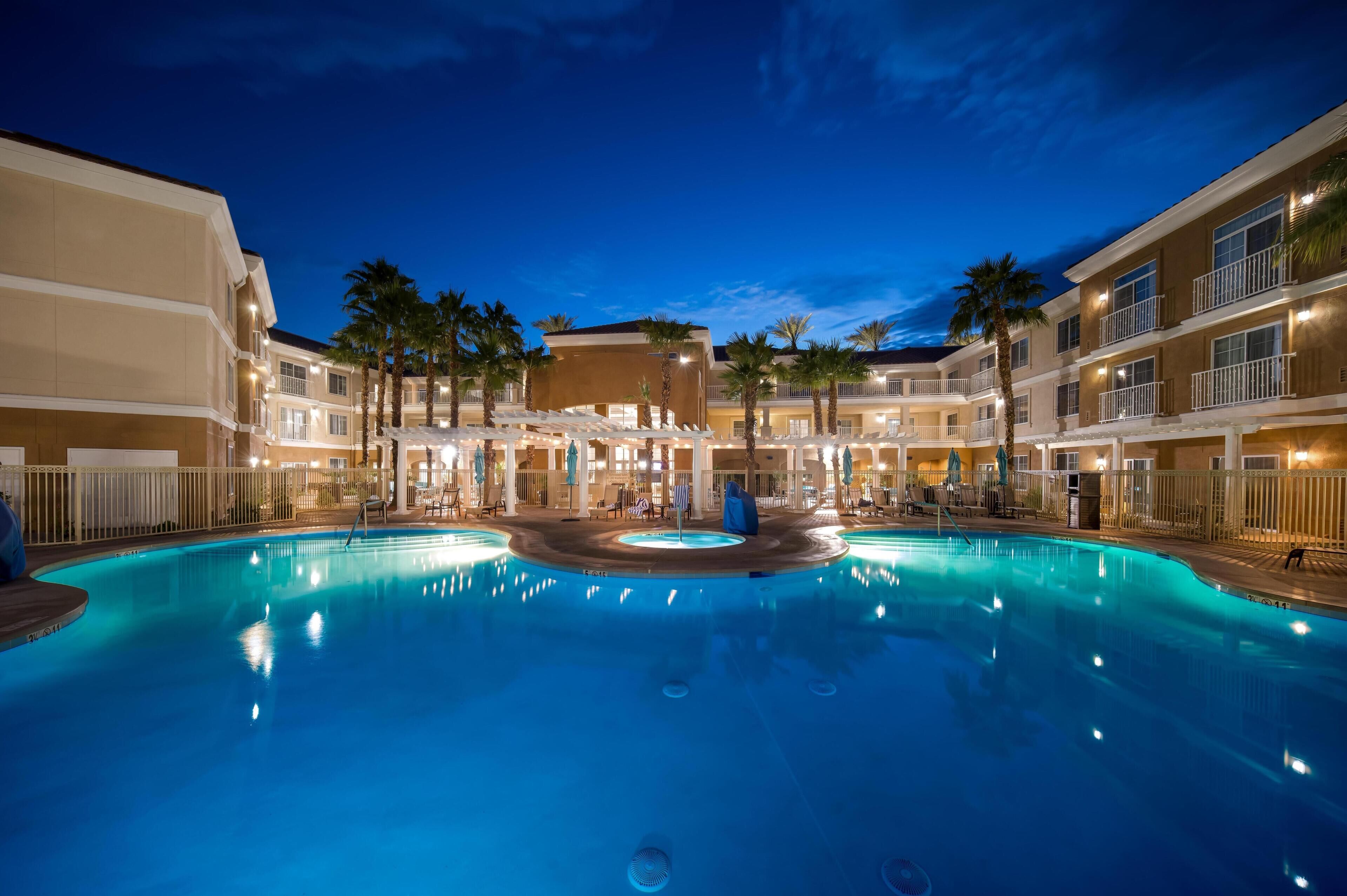 Outdoor pool, open 9:00 AM to 9:00 PM, pool loungers