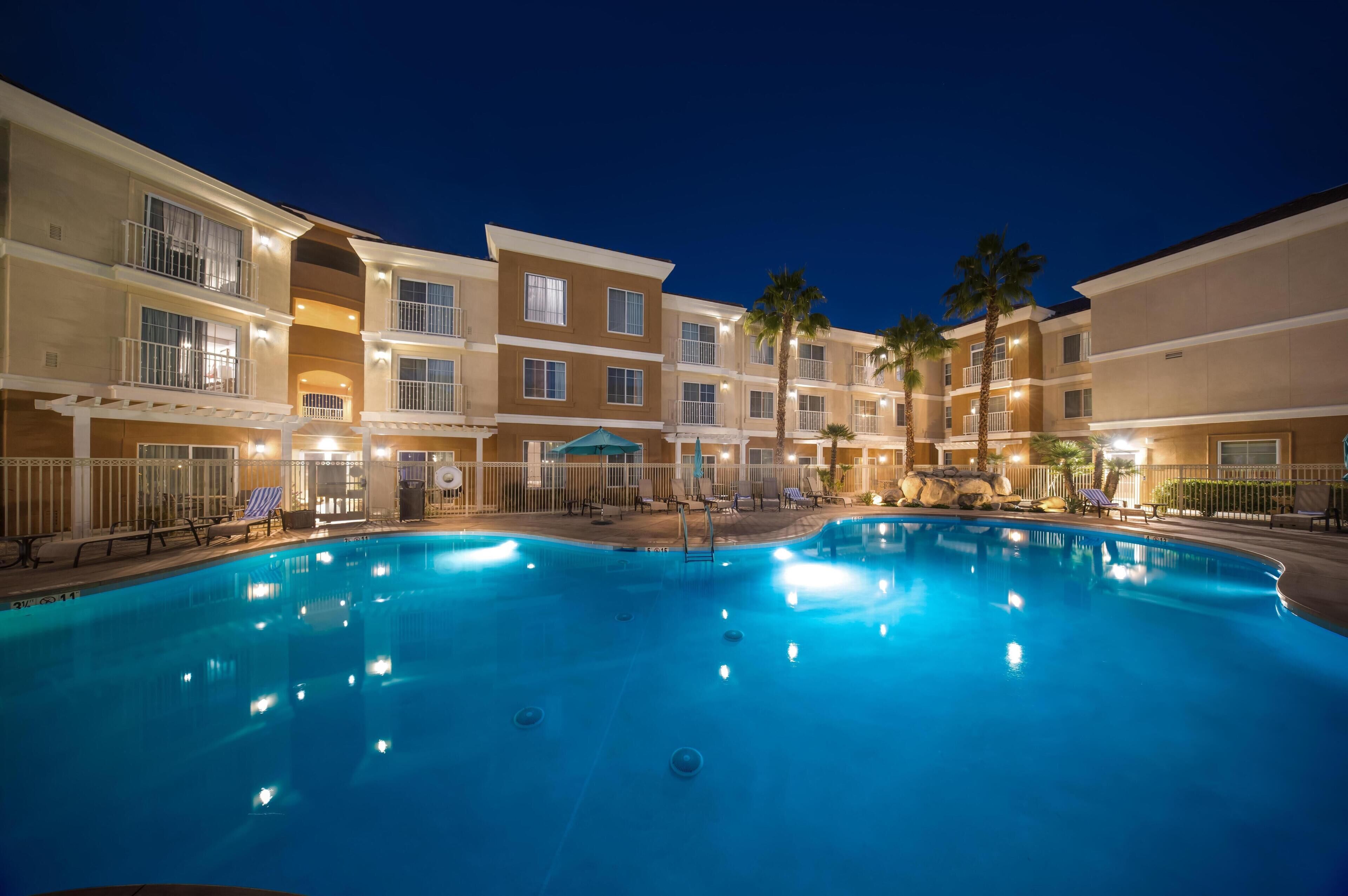 Outdoor pool, open 9:00 AM to 9:00 PM, pool loungers
