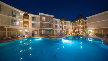 Outdoor pool, open 9:00 AM to 9:00 PM, pool loungers
