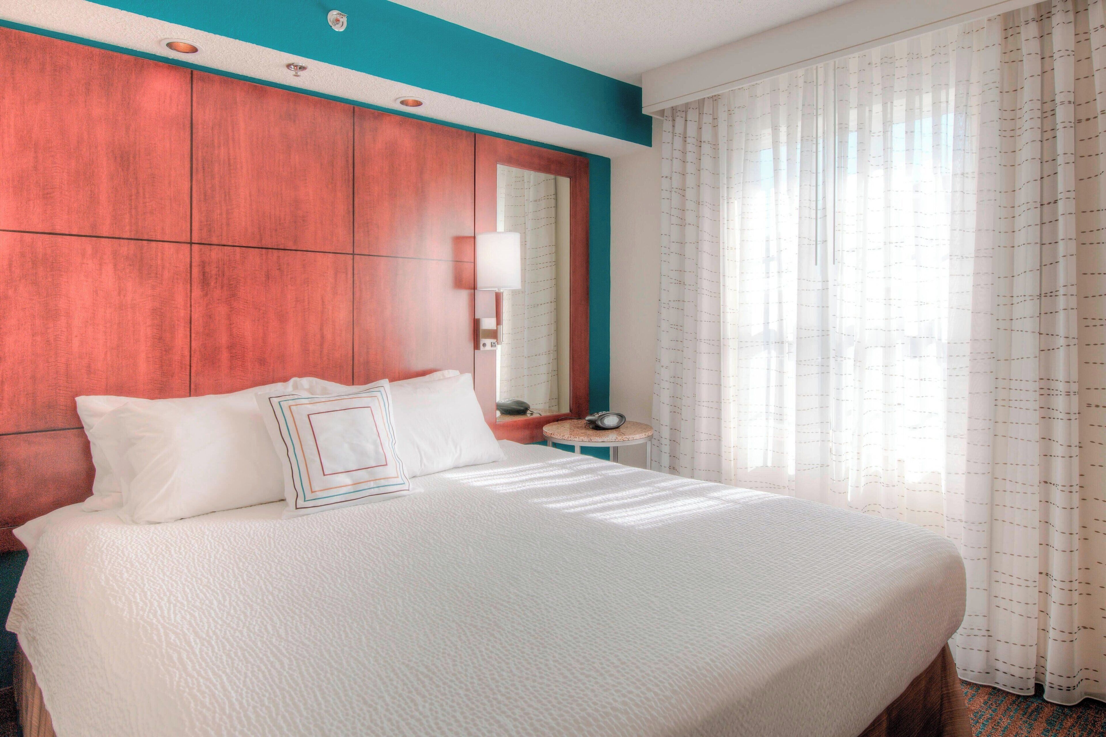 premium bedding, desk, blackout curtains, iron/ironing board