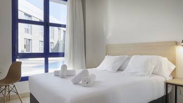 Verduisterende gordijnen, geluiddichte muren, gratis wifi, beddengoed