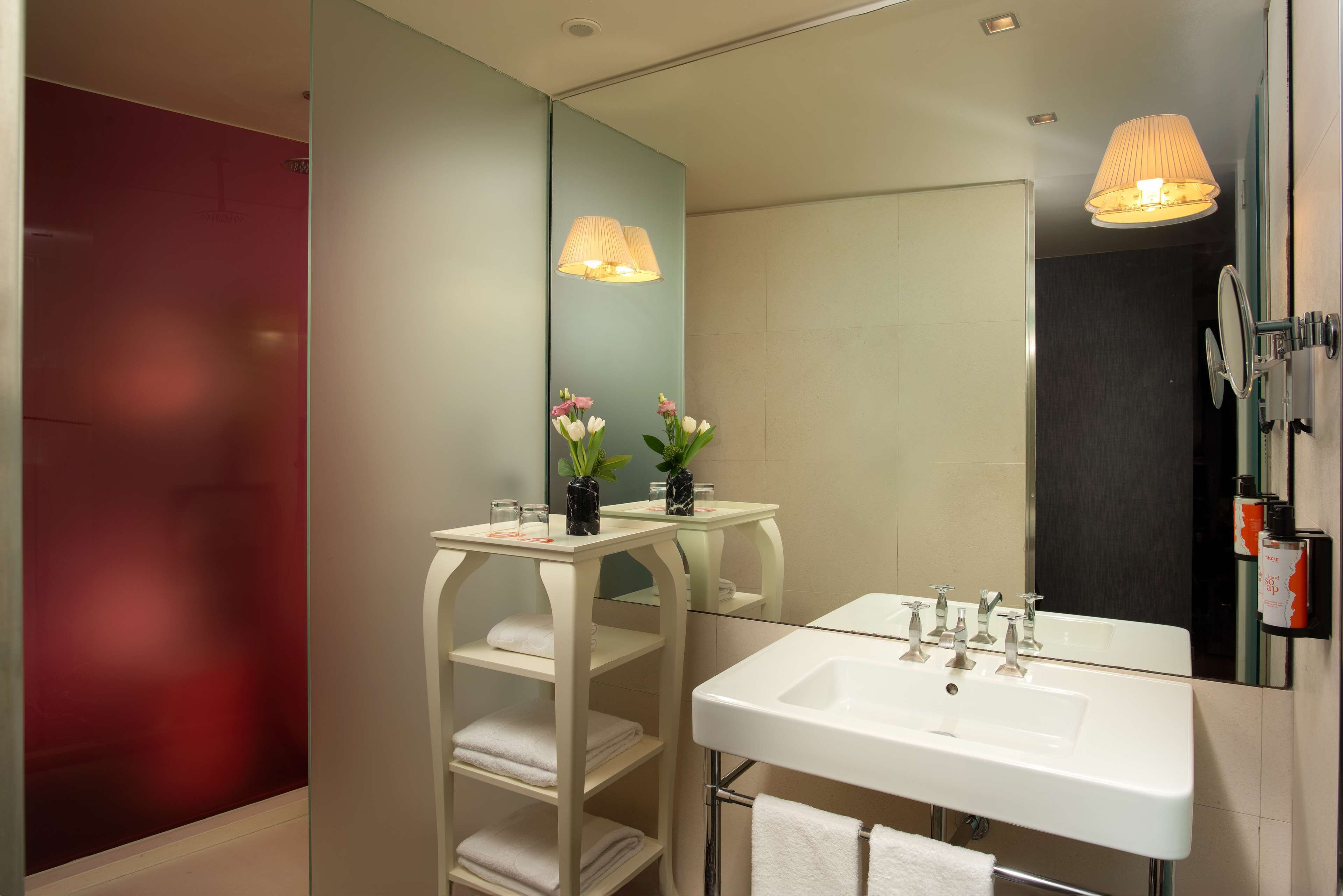 designer toiletries, hair dryer, bathrobes, bidet