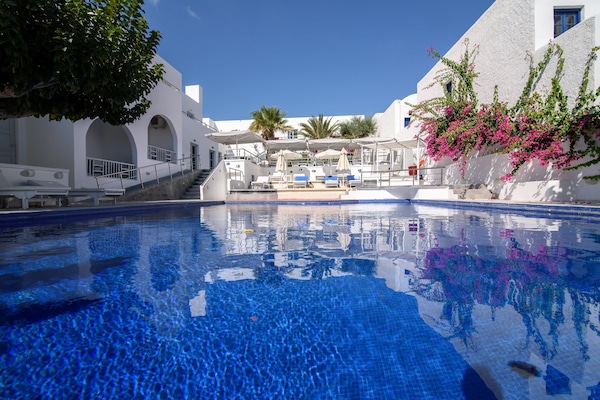 Outdoor pool, pool umbrellas, pool loungers