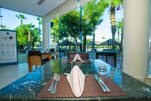 Breakfast, lunch, dinner served; pool views