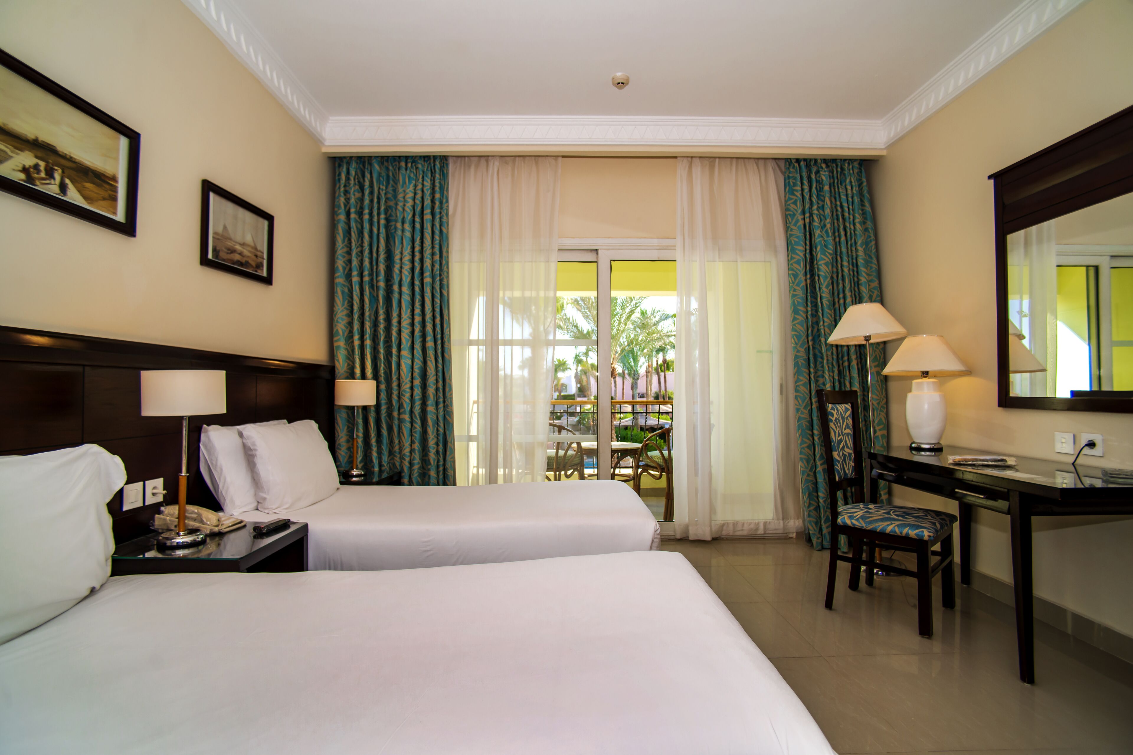 Standard Room, 3 Twin Beds, Garden View | Minibar, in-room safe, desk, iron/ironing board