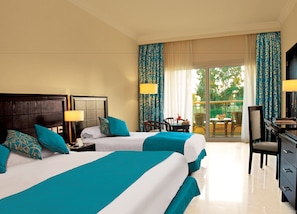 Standard Room, 3 Twin Beds, Garden View | Minibar, in-room safe, desk, iron/ironing board
