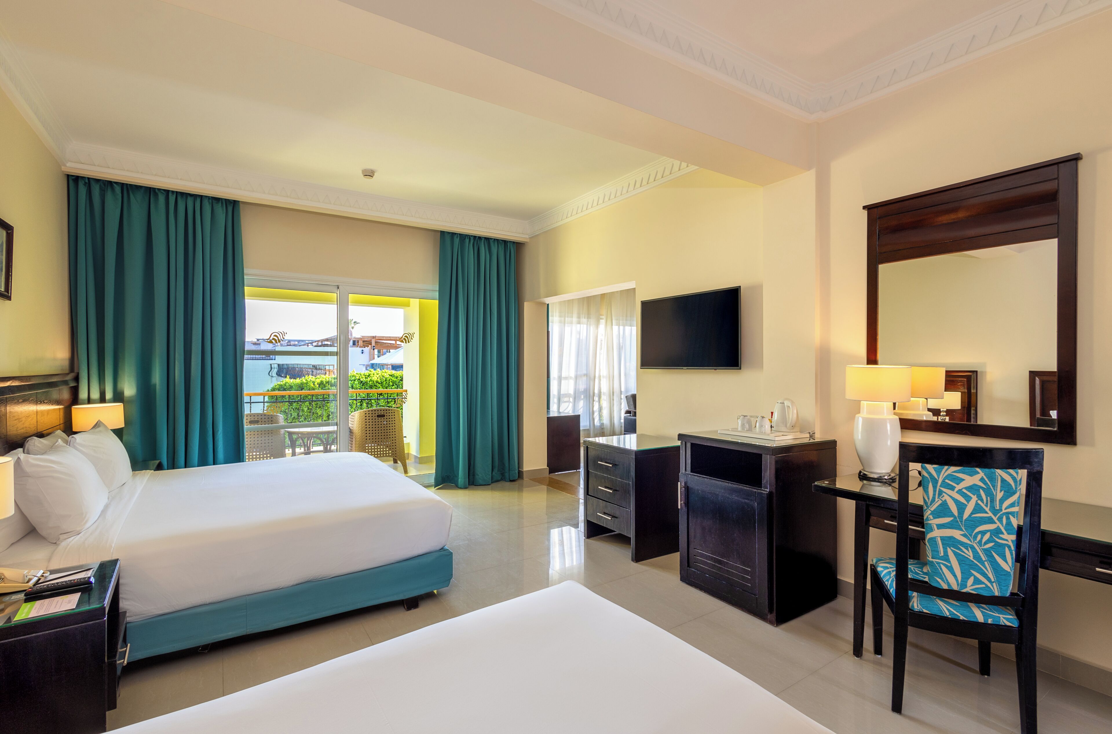 Suite, Pool View | Minibar, in-room safe, desk, iron/ironing board